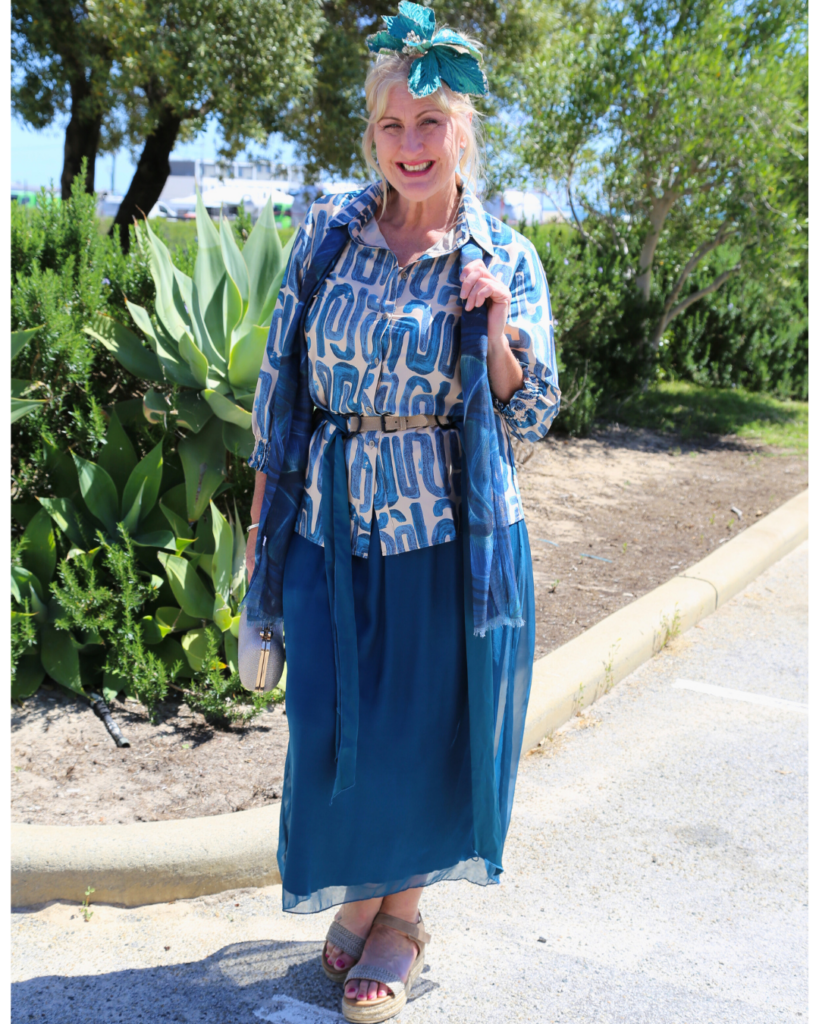 Teal silk skirt paired with a satin teal printed top, perfect for an elegant outfit for horse racing events.